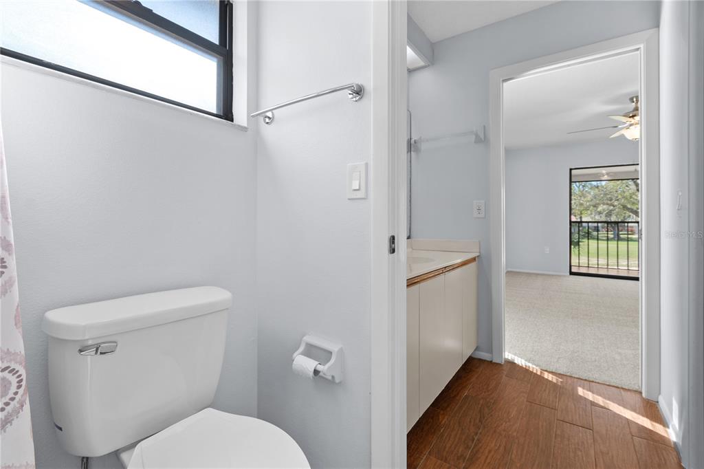 6110 Country Club Way, Unit 204 Sarasota, FL 34243 - Photo 25 of 66 a bathroom with a toilet and a shower