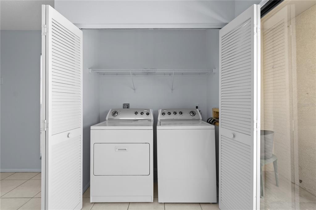 6110 Country Club Way, Unit 204 Sarasota, FL 34243 - Photo 39 of 66 a utility room with dryer and washer