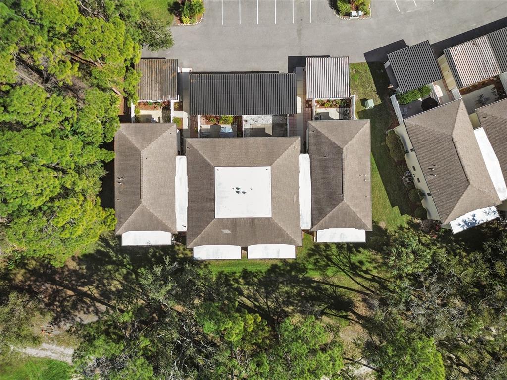6110 Country Club Way, Unit 204 Sarasota, FL 34243 - Photo 55 of 66 an aerial view of a house with garden space and street view