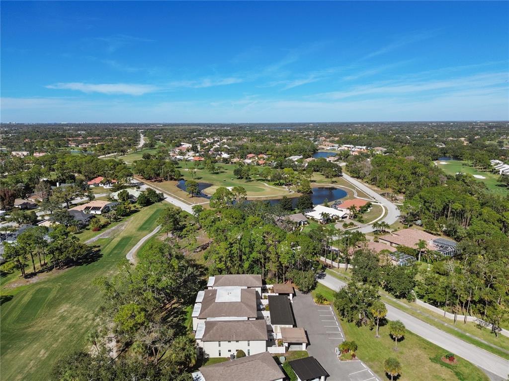 6110 Country Club Way, Unit 204 Sarasota, FL 34243 - Photo 56 of 66 an aerial view of residential houses with outdoor space