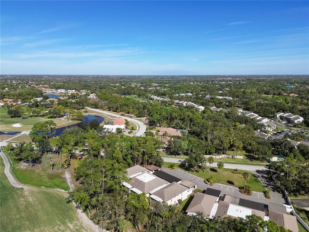 6110 Country Club Way, Unit 204 Sarasota, FL 34243 - Photo 57 of 66 an aerial view of residential houses with outdoor space