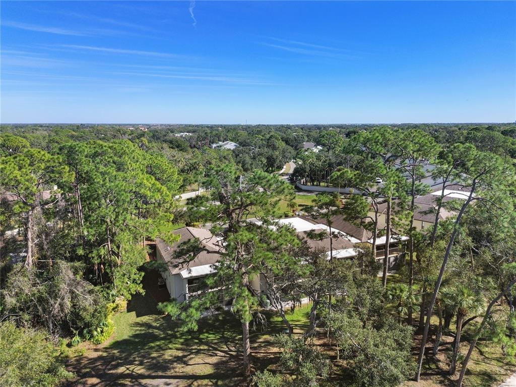 6110 Country Club Way, Unit 204 Sarasota, FL 34243 - Photo 65 of 66 a view of a city with lush green forest