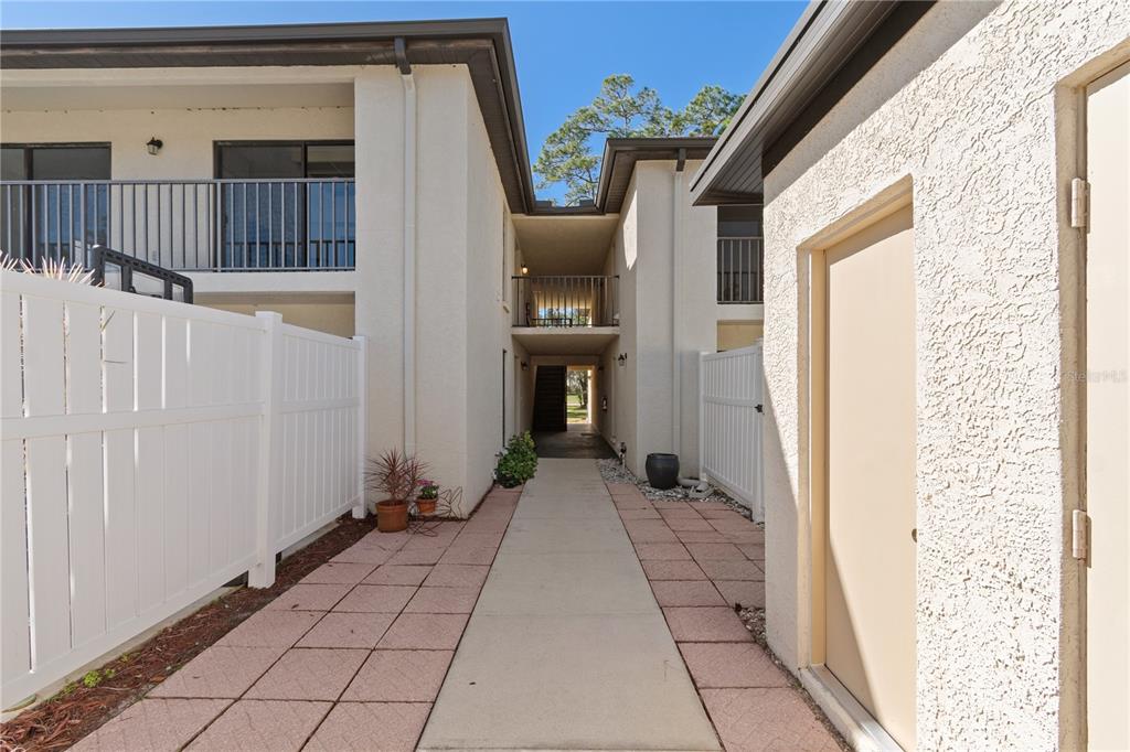 6110 Country Club Way, Unit 204 Sarasota, FL 34243 - Photo 8 of 66 a view of a house with brick walls