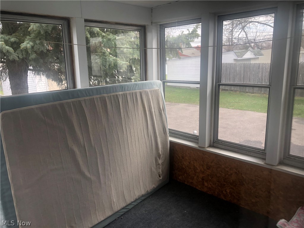 4037 Wilmington Road Cleveland, OH 44121 - Photo 20 of 36 Unfurnished sunroom featuring carpet floors