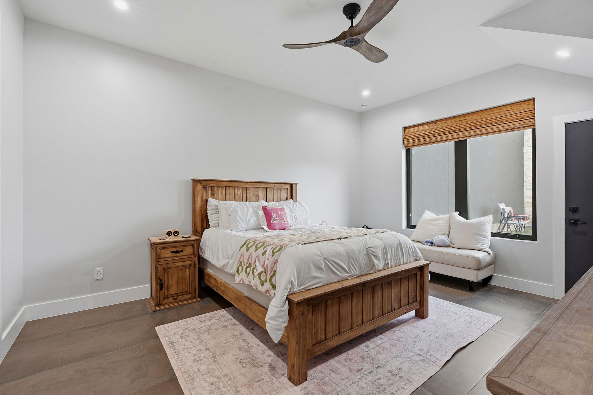 194 Placid Way Spring Branch, TX 78070 - Photo 24 of 37 a bedroom with a bed couch and window