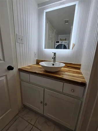 a bathroom with a sink and a mirror
