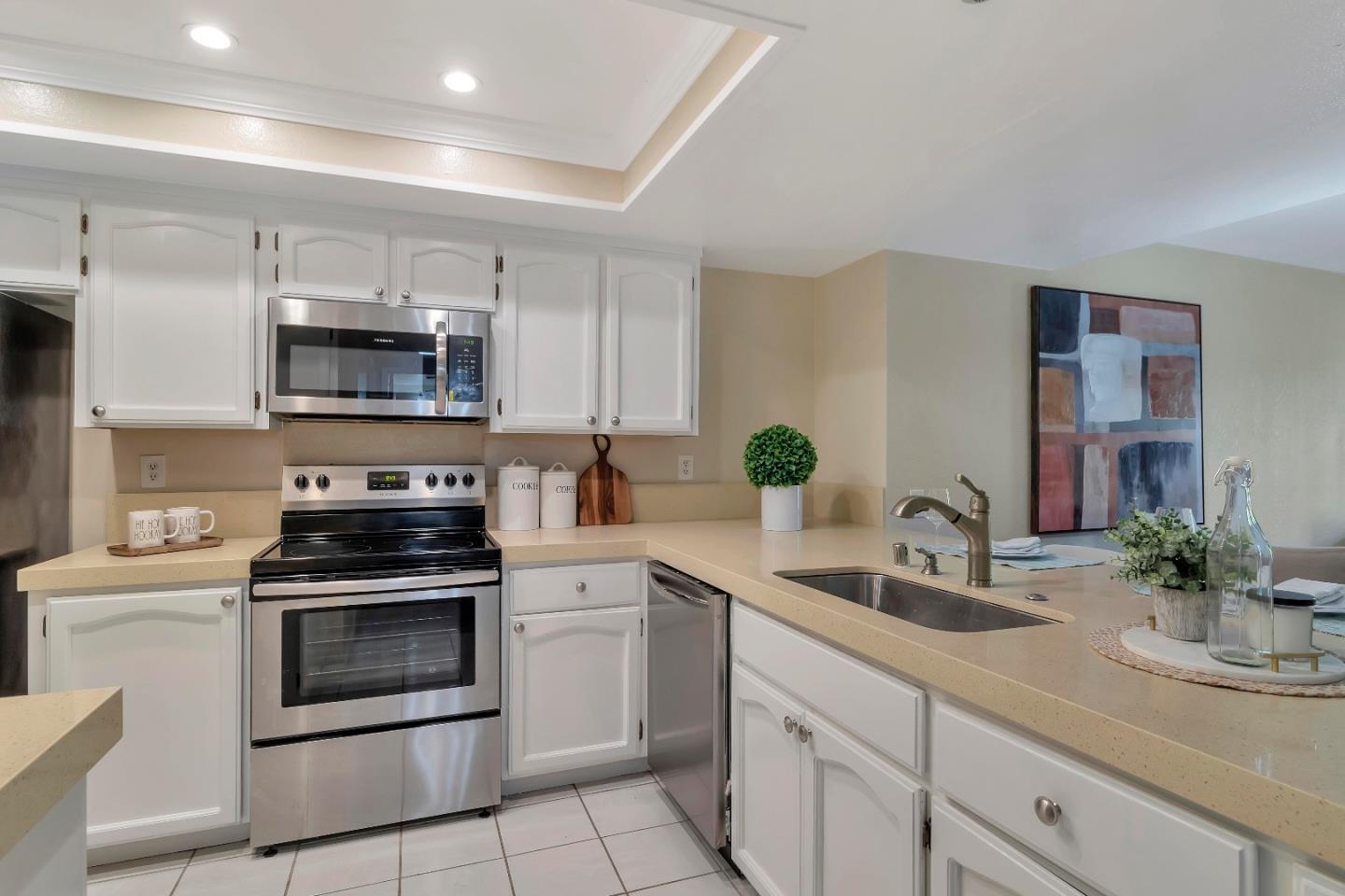 20682 Celeste Circle Cupertino, CA 95014 - Photo 12 of 31 a kitchen with a sink stove and microwave
