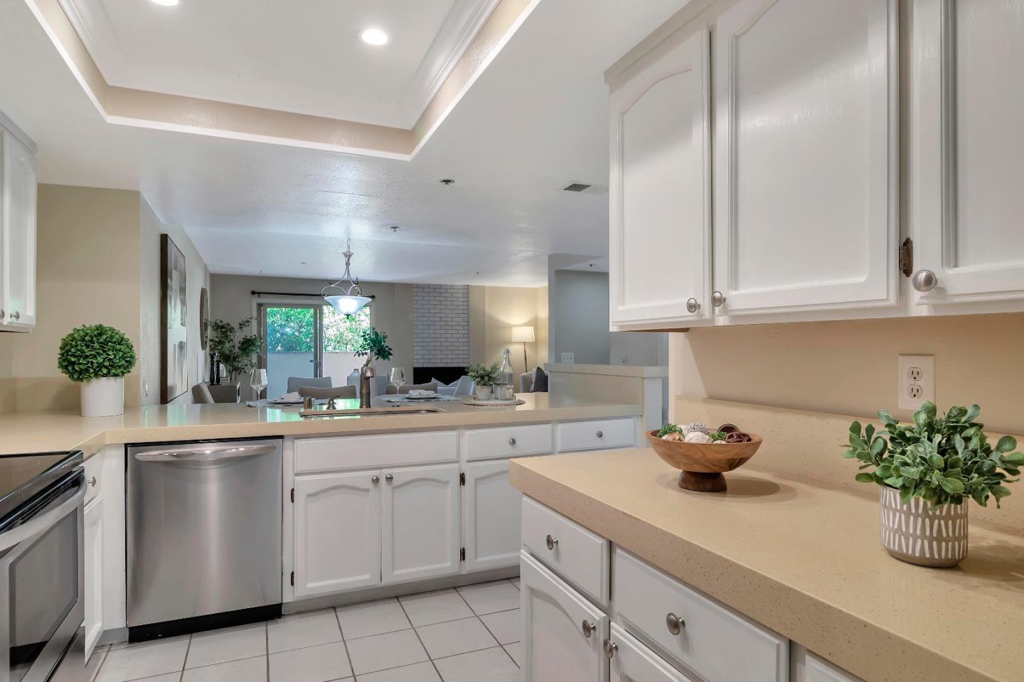 20682 Celeste Circle Cupertino, CA 95014 - Photo 14 of 31 a kitchen with white cabinets and a sink
