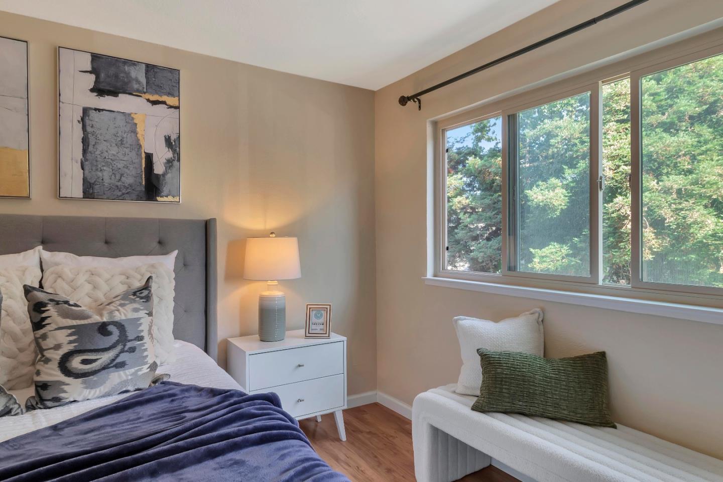 20682 Celeste Circle Cupertino, CA 95014 - Photo 19 of 31 a bedroom with a bed and wooden floor