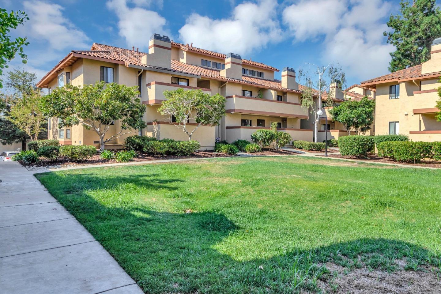 20682 Celeste Circle Cupertino, CA 95014 - Photo 2 of 31 a front view of a building with a garden
