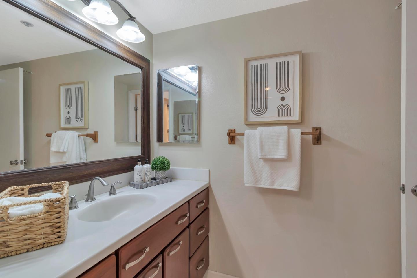 20682 Celeste Circle Cupertino, CA 95014 - Photo 22 of 31 a bathroom with a sink and a mirror