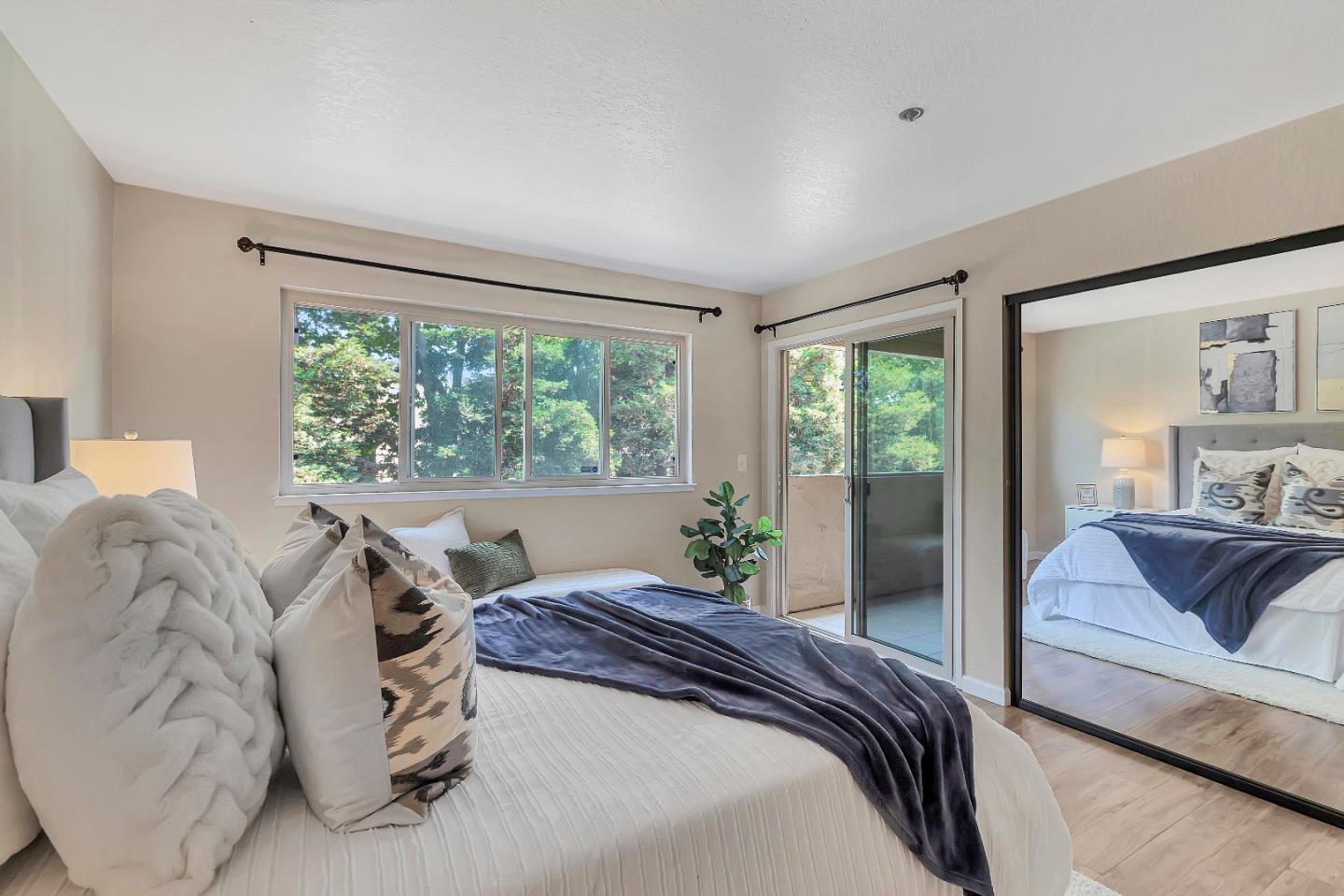 20682 Celeste Circle Cupertino, CA 95014 - Photo 23 of 31 a bedroom with a large bed and a couch