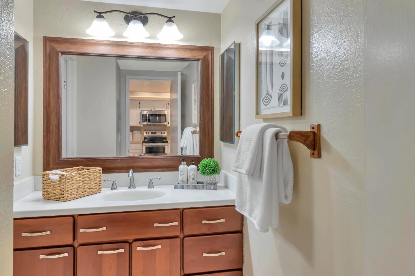 20682 Celeste Circle Cupertino, CA 95014 - Photo 27 of 31 a bathroom with a sink and a mirror