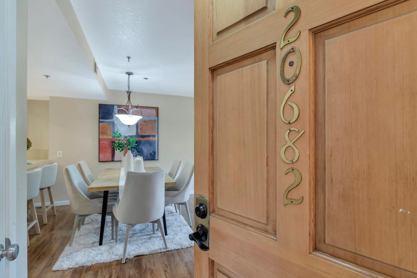 20682 Celeste Circle Cupertino, CA 95014 - Photo 4 of 31 a view of a dining room with furniture window and wooden floor