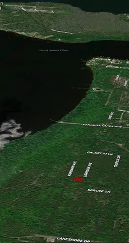 a view of a golf course with a lake