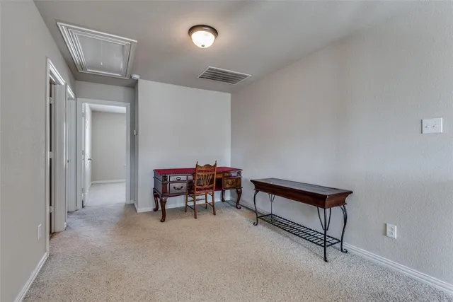 a view of game room with windows