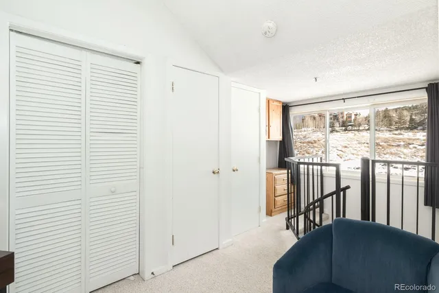 a bathroom with a sink vanity mirror and toilet