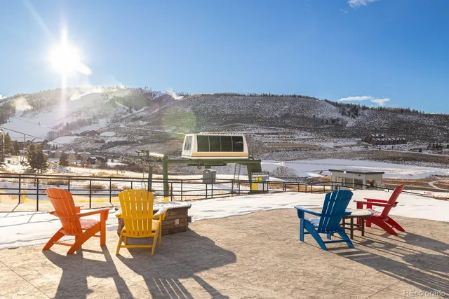 a view of a swimming pool with an outdoor seating