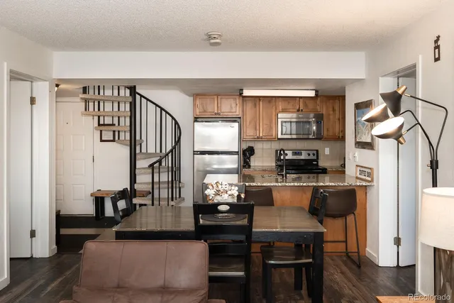 a kitchen with sink and cabinets