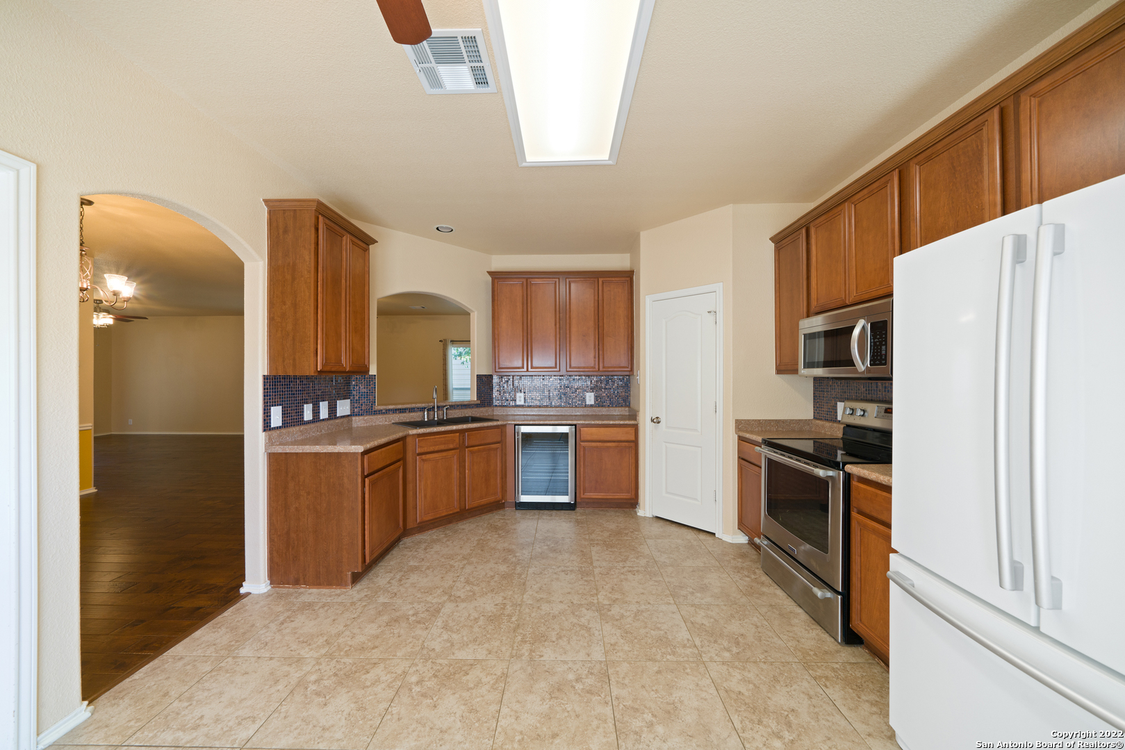 308 Rustic Trail Cibolo, TX 78108 - Photo 11 of 25 a large kitchen with a large counter top stainless steel appliances and cabinets
