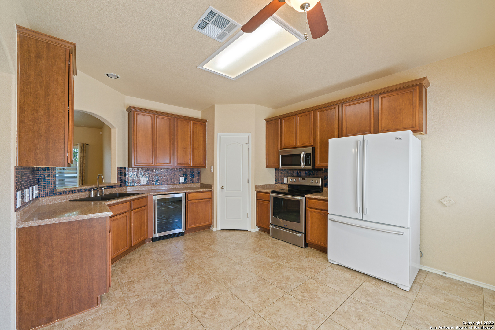 308 Rustic Trail Cibolo, TX 78108 - Photo 12 of 25 a kitchen with a refrigerator stove and sink