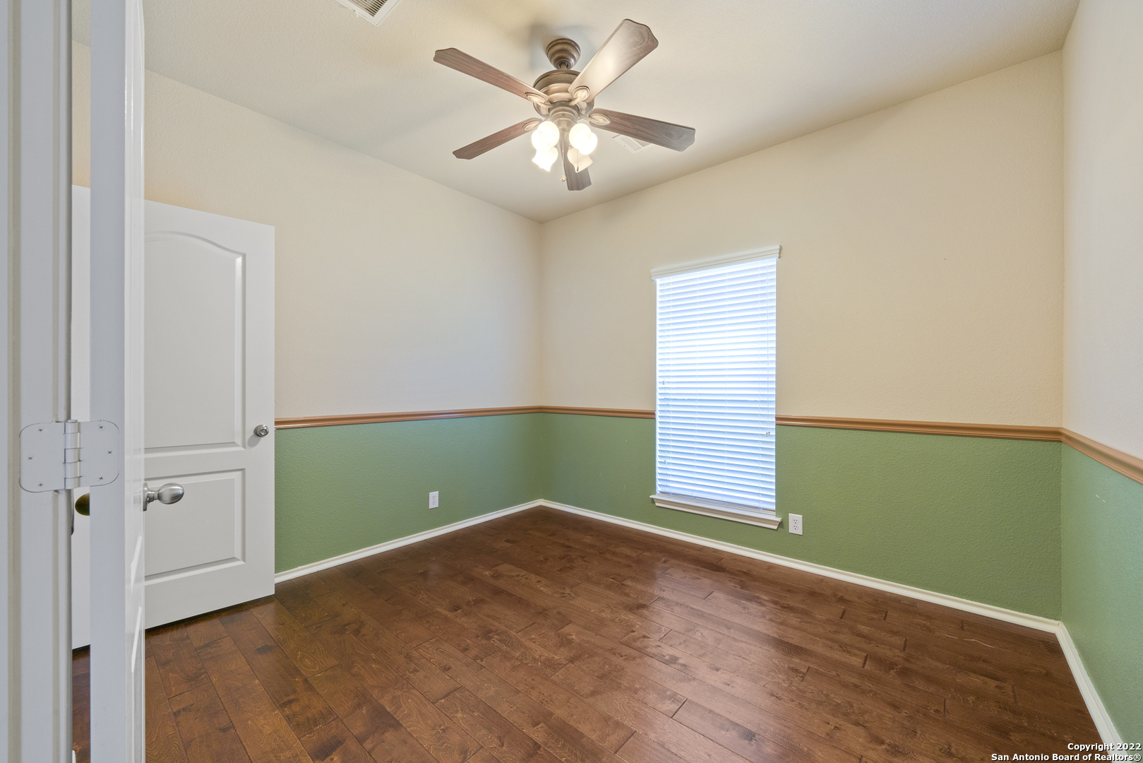 308 Rustic Trail Cibolo, TX 78108 - Photo 18 of 25 an empty room with windows and fan