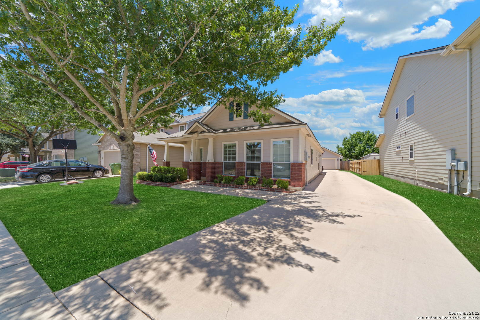 308 Rustic Trail Cibolo, TX 78108 - Photo 3 of 25 a front view of a house with a garden and trees