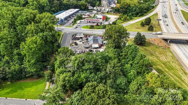 an aerial view of an house with swimming pool and garden