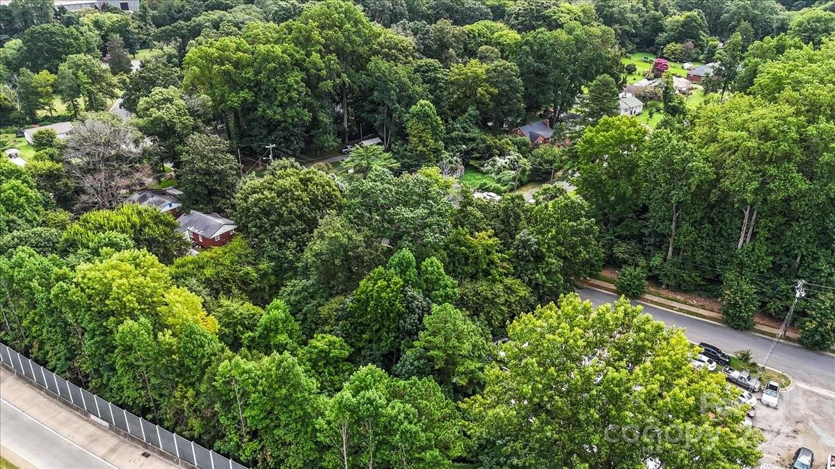 734 Dewolfe Street Charlotte, NC 28208 - Photo 7 of 9 an aerial view of residential house with outdoor space and trees all around
