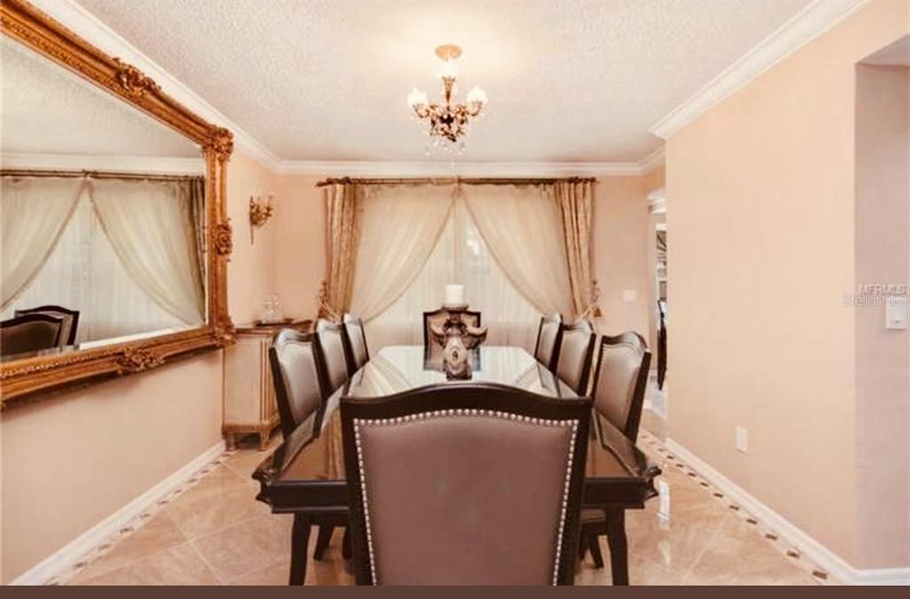 6850 Spring Rain Drive Orlando, FL 32819 - Photo 11 of 35 a view of a dining room with furniture window and outside view
