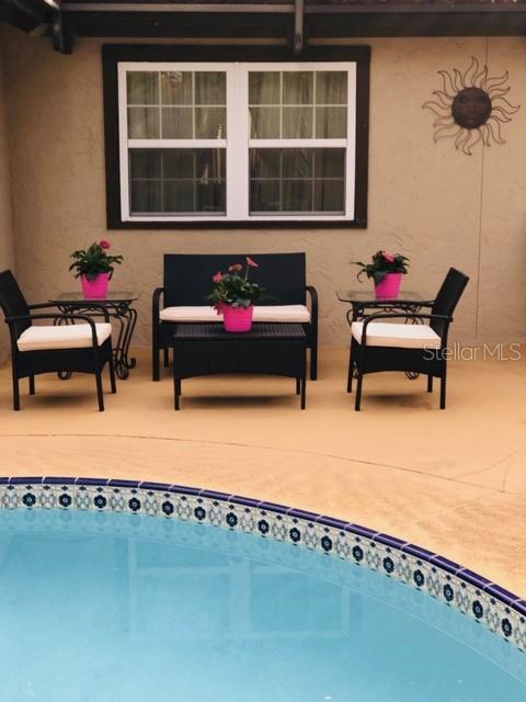 6850 Spring Rain Drive Orlando, FL 32819 - Photo 26 of 35 a building outdoor space with patio furniture