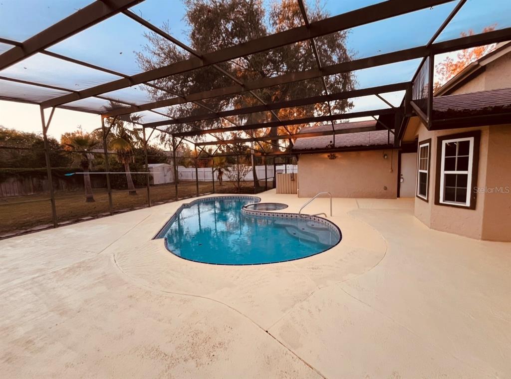 6850 Spring Rain Drive Orlando, FL 32819 - Photo 31 of 35 a view of outdoor space with a swimming pool