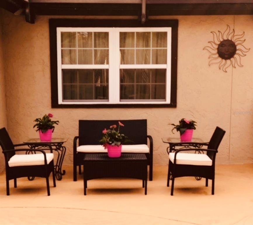 6850 Spring Rain Drive Orlando, FL 32819 - Photo 32 of 35 a building outdoor space with patio furniture