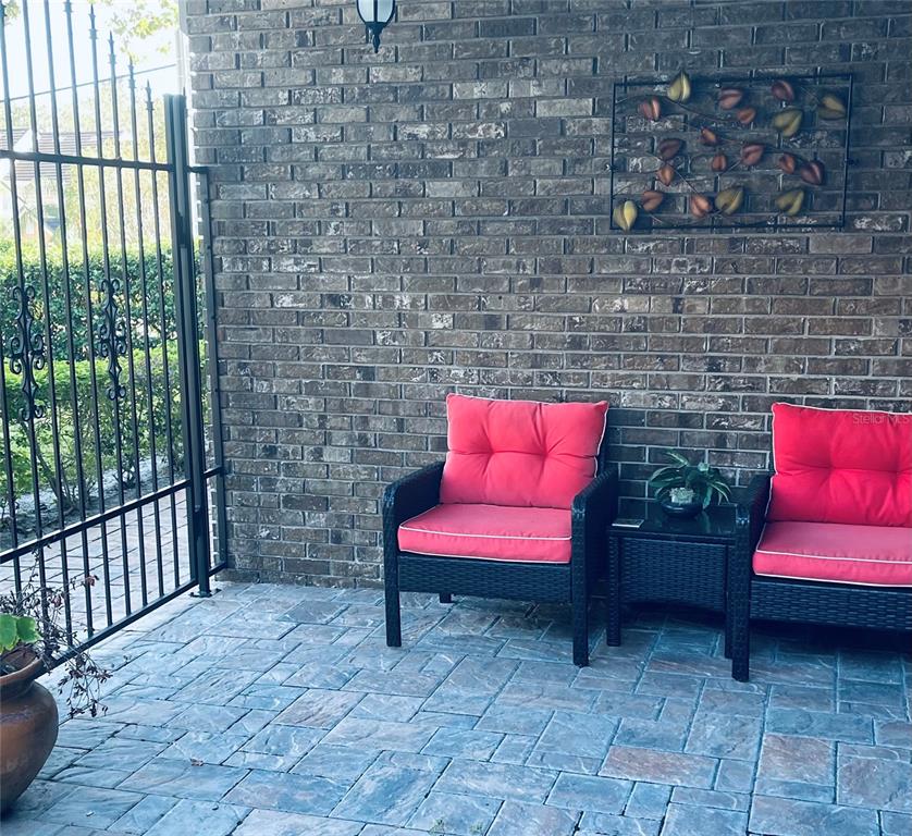 6850 Spring Rain Drive Orlando, FL 32819 - Photo 34 of 35 a outdoor view with a couch and a potted plant