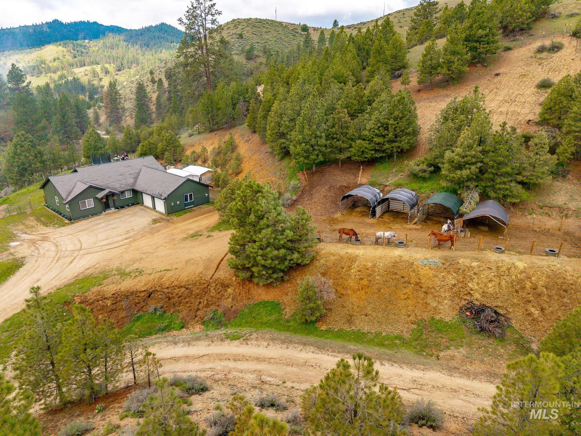 4 Round Up Circle Boise, ID 83716 - Photo 5 of 47 Ranch-style residence featuring a dark green exterior and attached two-car garage