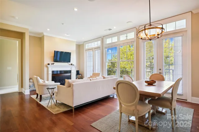 a living room with furniture fireplace and a flat screen tv
