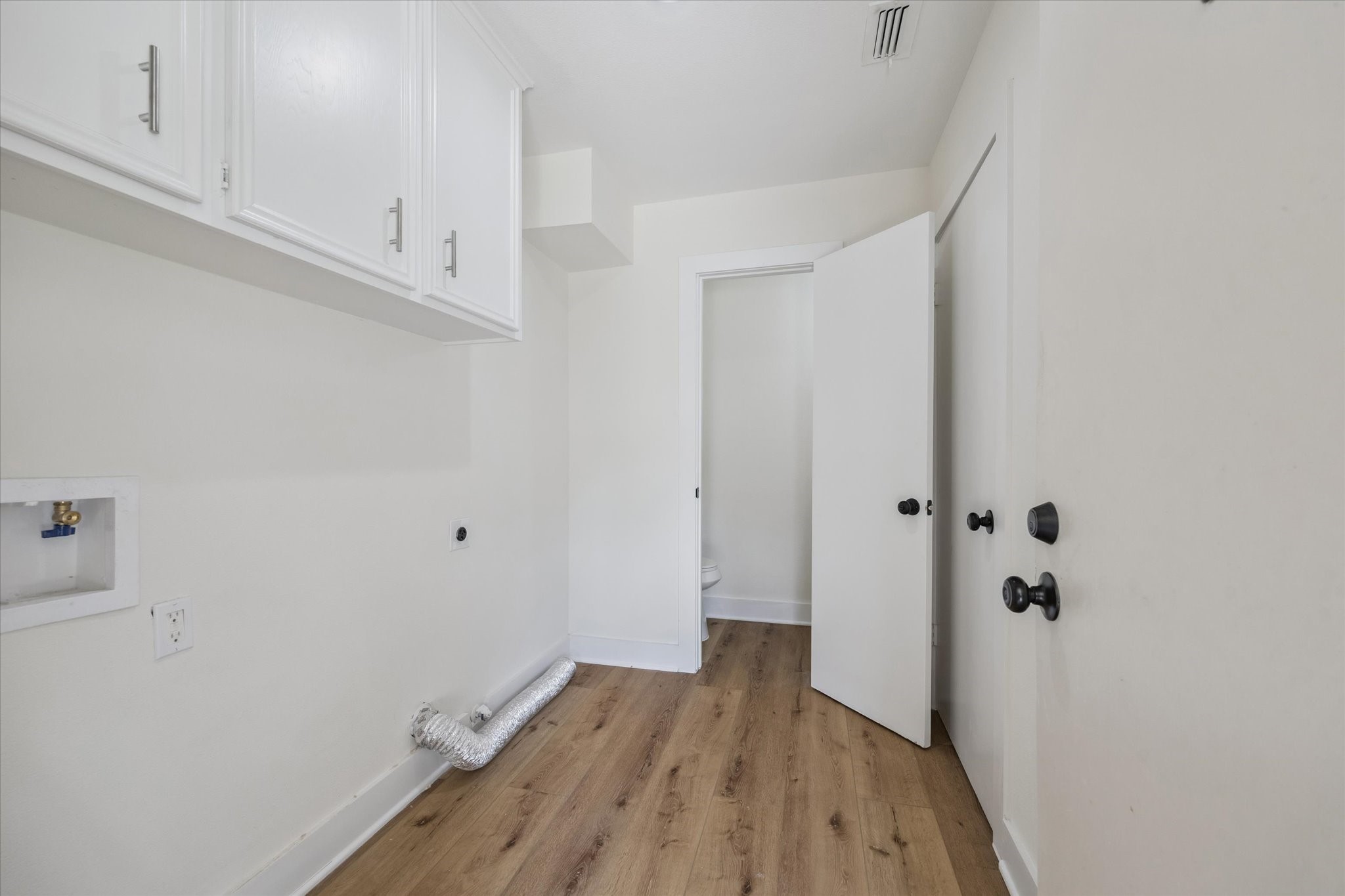 2723 Bernadette Lane Houston, TX 77043 - Photo 15 of 32 a view of small space with wooden floor