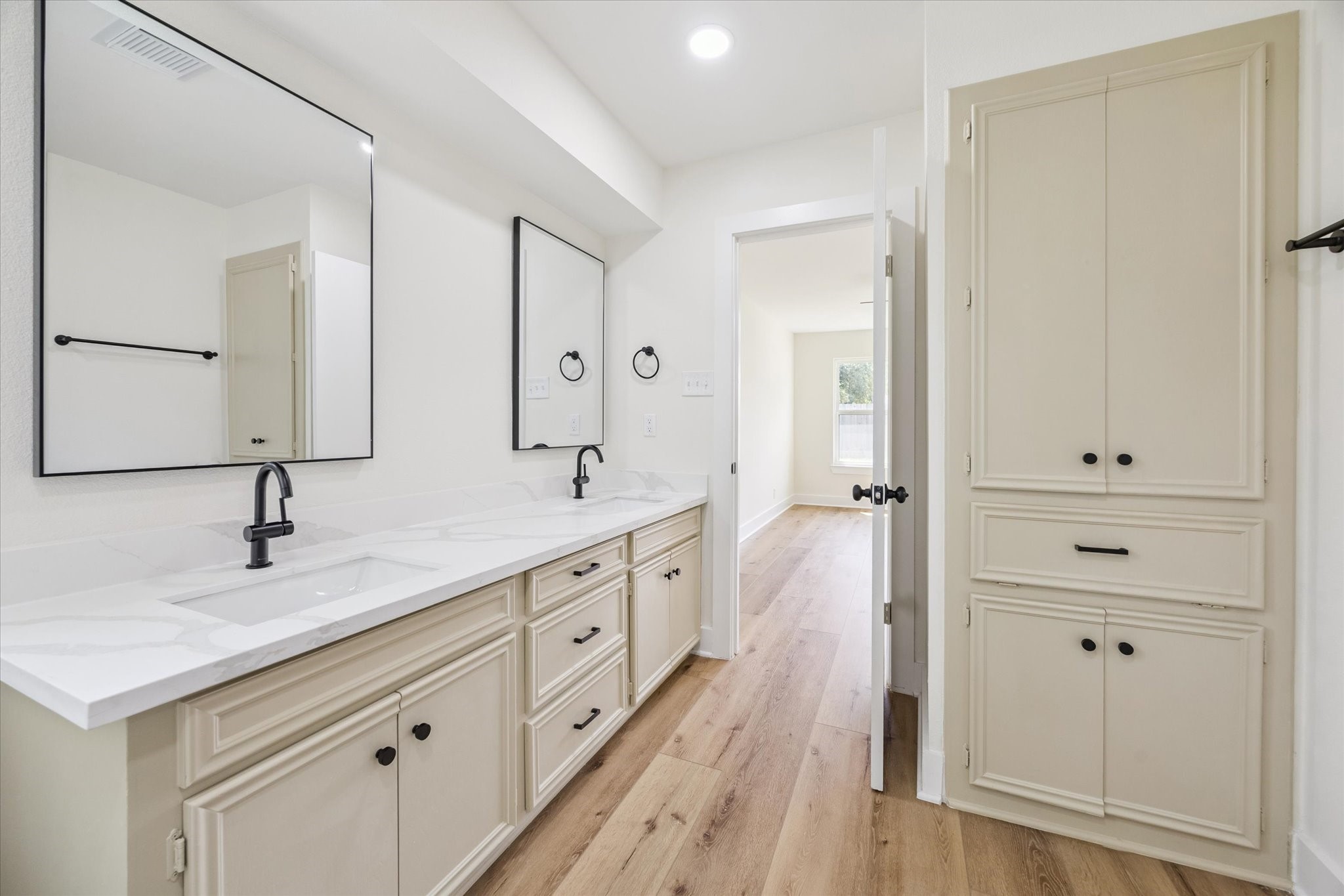 2723 Bernadette Lane Houston, TX 77043 - Photo 21 of 32 a spacious bathroom with a double vanity sink a mirror and shower
