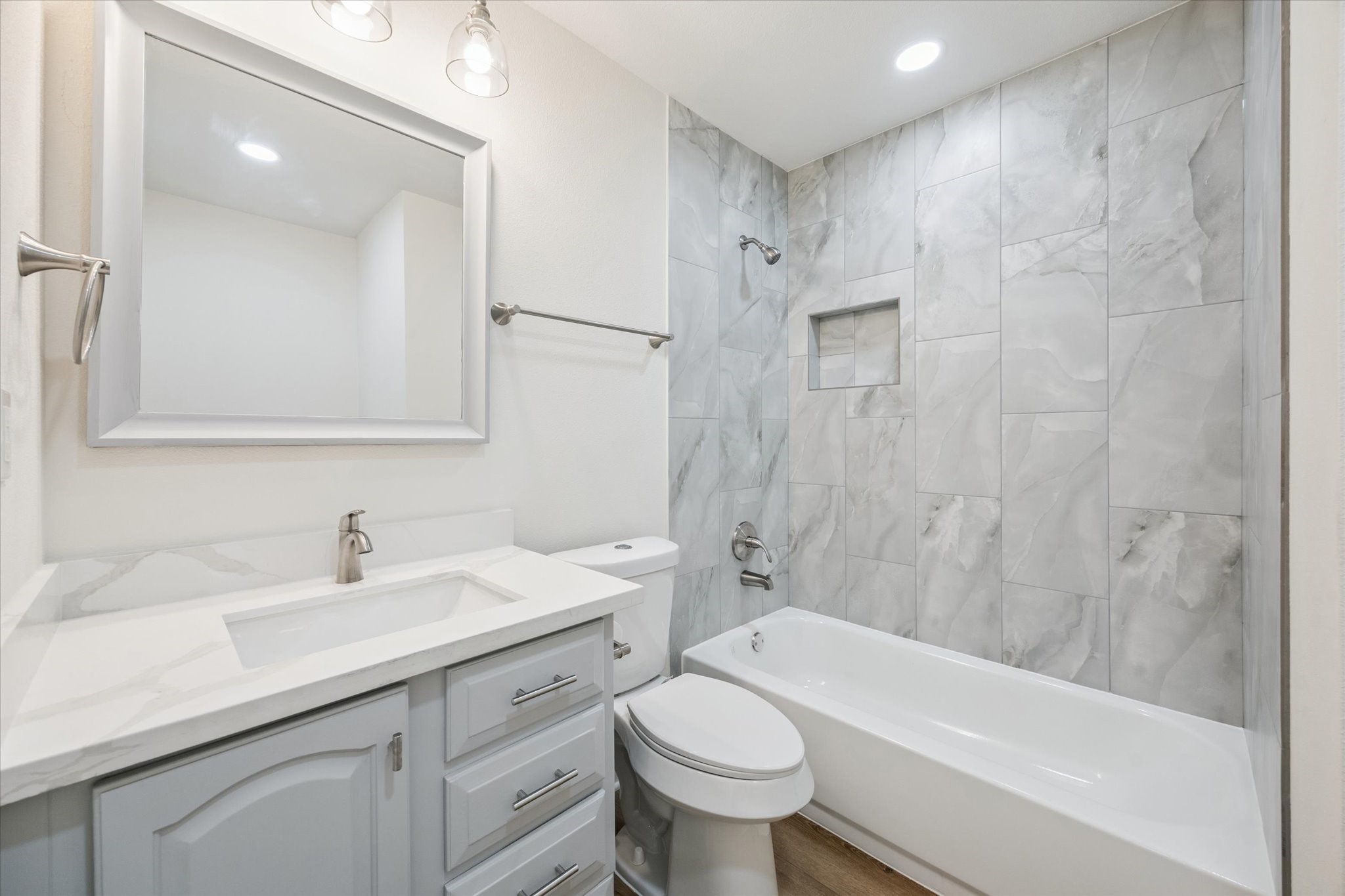2723 Bernadette Lane Houston, TX 77043 - Photo 27 of 32 a bathroom with a sink a toilet and shower