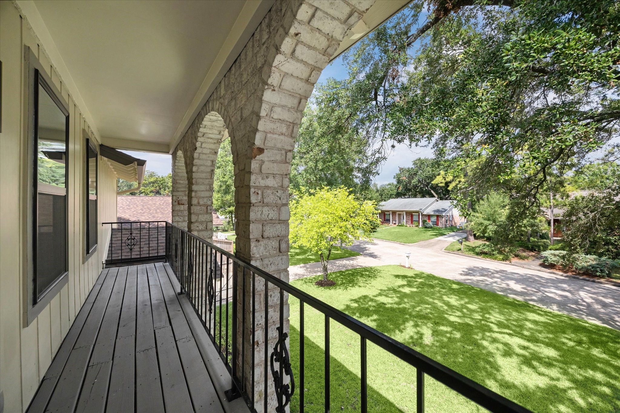 2723 Bernadette Lane Houston, TX 77043 - Photo 29 of 32 a view of a balcony with wooden floor