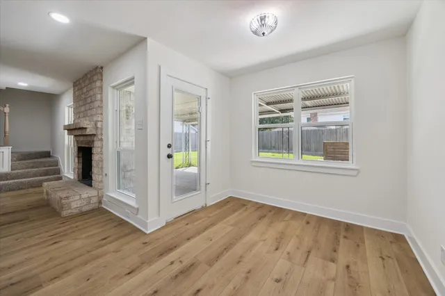 a view of livingroom with hardwood floor and hallway