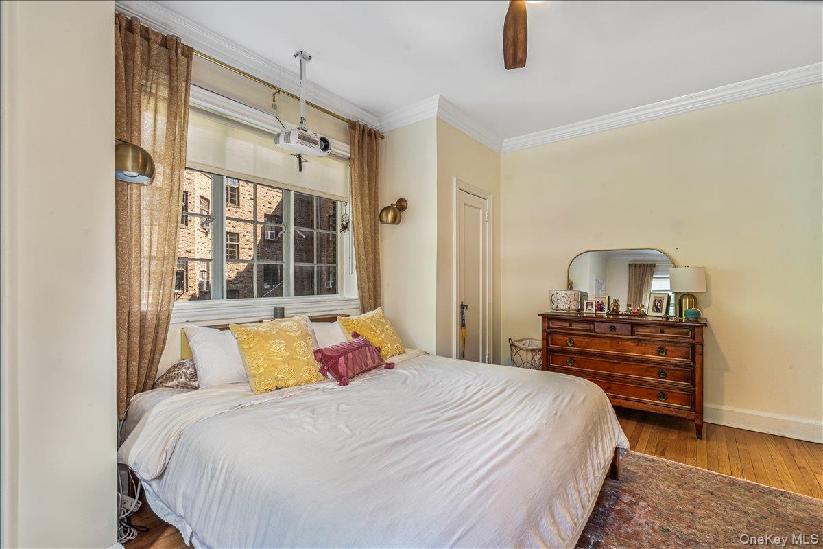 38-30 Douglaston Parkway, Unit G2 Queens, NY 11363 - Photo 11 of 19 a bedroom with a bed and a window