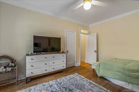 a bedroom with a bed and flat screen tv