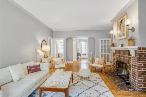 a living room with furniture fireplace and a fireplace