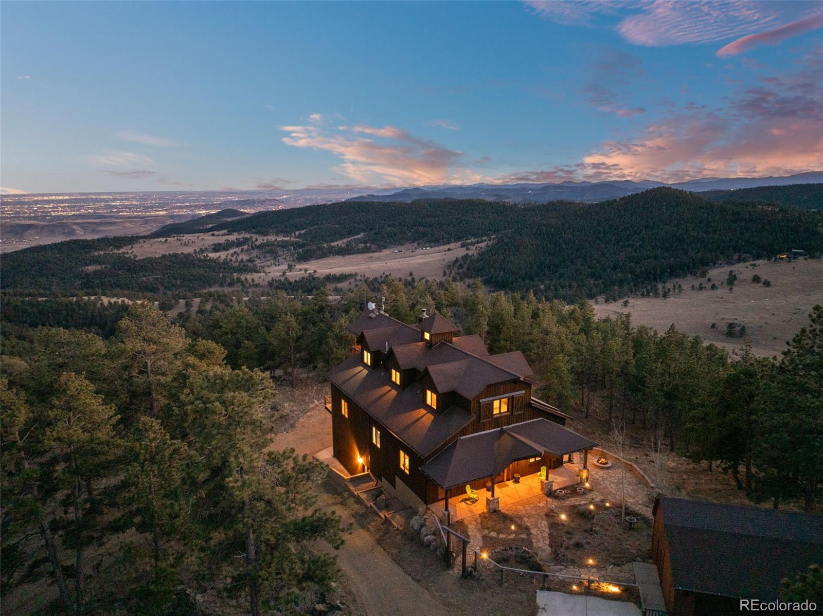 27659 Misty Road Golden, CO 80403 - Photo 1 of 50 a view of a lake in middle of the forest