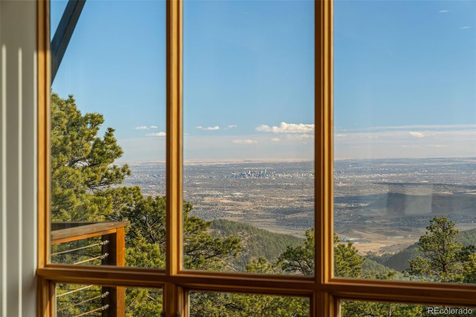 27659 Misty Road Golden, CO 80403 - Photo 15 of 50 a view of a glass door and an outdoor space