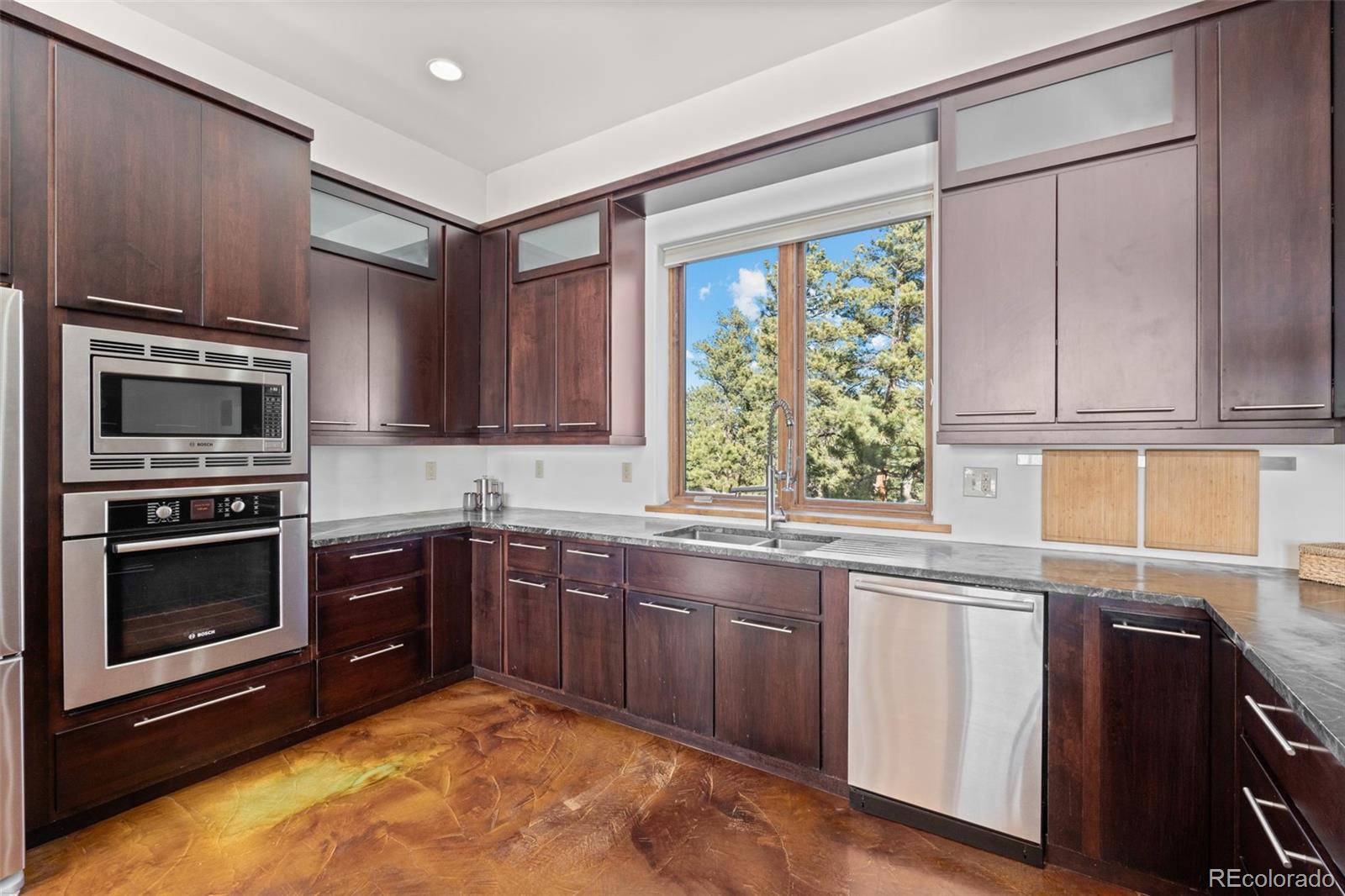 27659 Misty Road Golden, CO 80403 - Photo 18 of 50 a kitchen with a sink stove and microwave