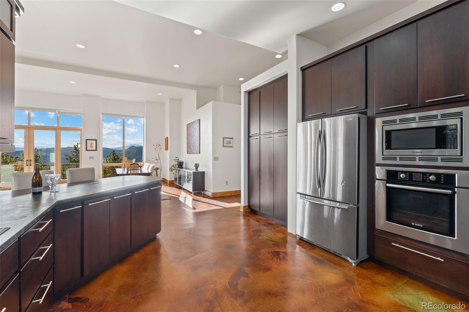 27659 Misty Road Golden, CO 80403 - Photo 19 of 50 a kitchen with stainless steel appliances wooden cabinets and a refrigerator