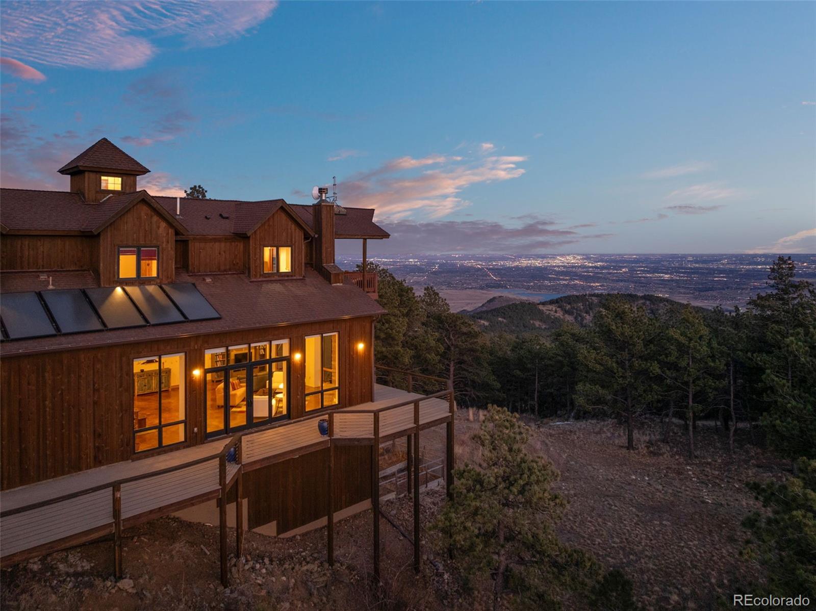27659 Misty Road Golden, CO 80403 - Photo 2 of 50 a view of a large building with a mountain in the background