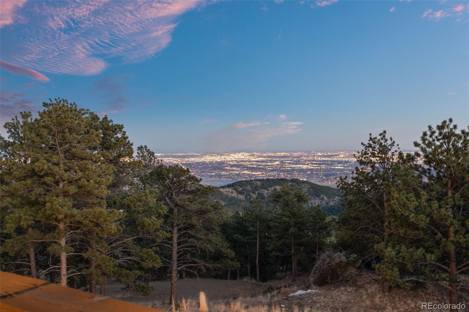 27659 Misty Road Golden, CO 80403 - Photo 22 of 50 a view of a city with lush green forest